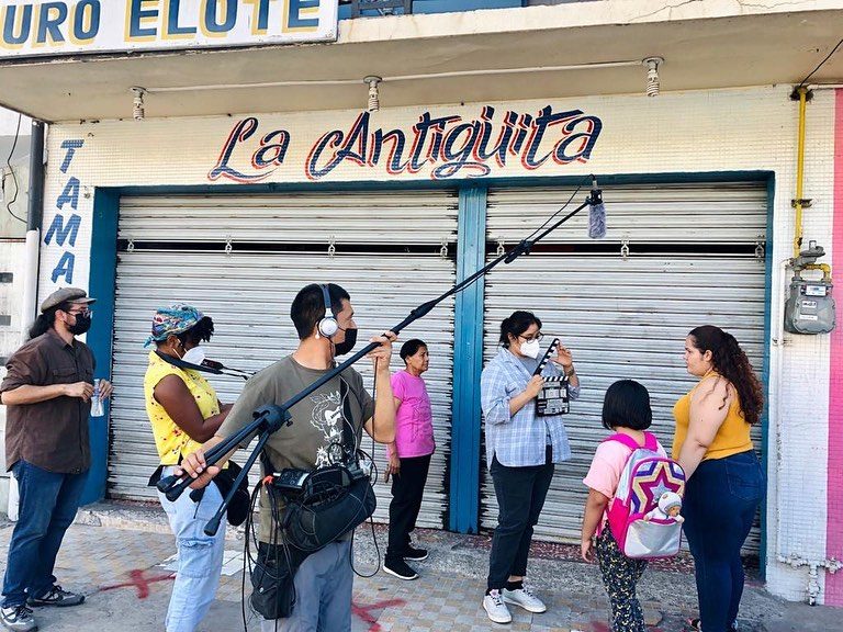 People recording a soap opera with migrants in Tijuana, Baja California.