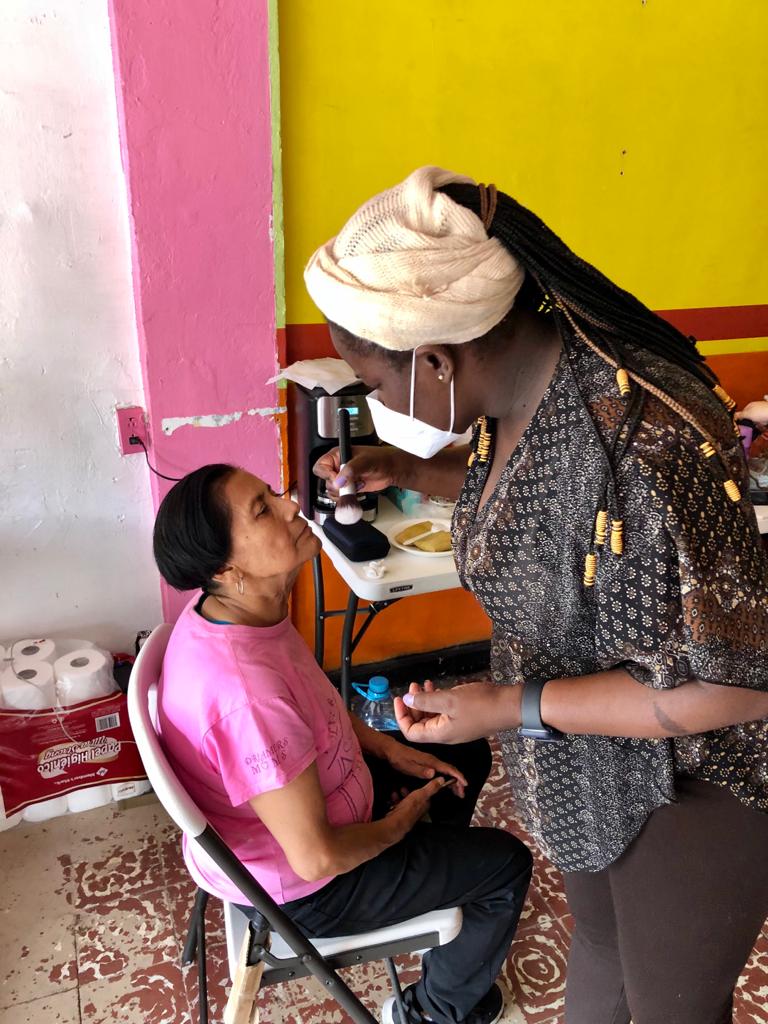 Women getting made up to act in the migrant telenovela in Tijuana.